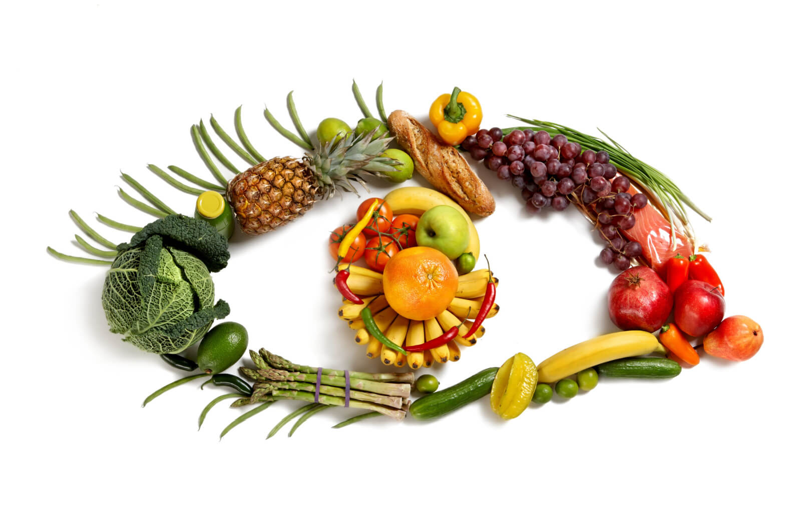 An assortment of fruits, vegetables, and fish arranged in the shape of an eye represents a natural source of vitamins essential for eye health.