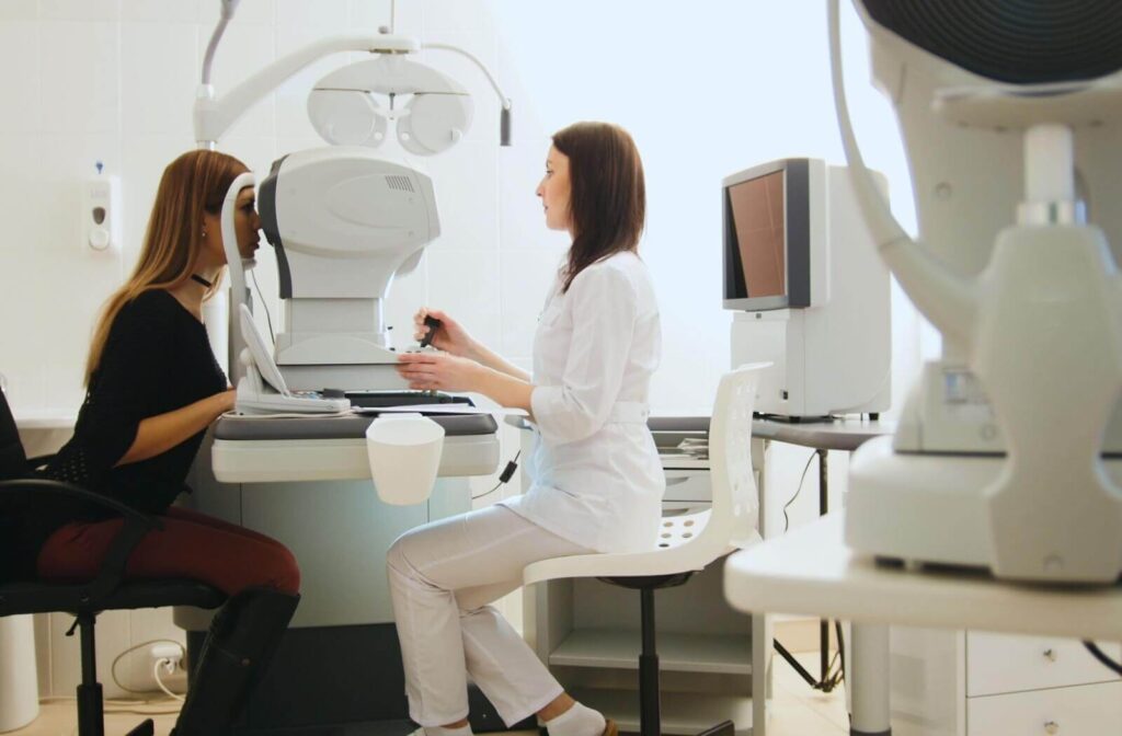 A technician uses non-contact tonometry to evaluate a patient's eye pressure during a routine eye exam.