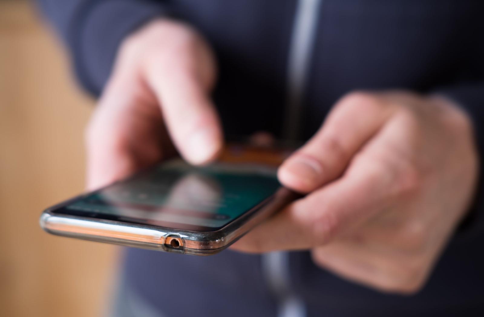 A person texting on their phone